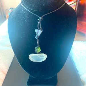 Contemporary sea glass necklace on a black cord